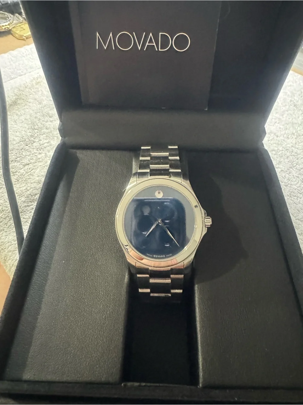 #184 Movado Men's Silver Watch with Blue Sunburst Dial